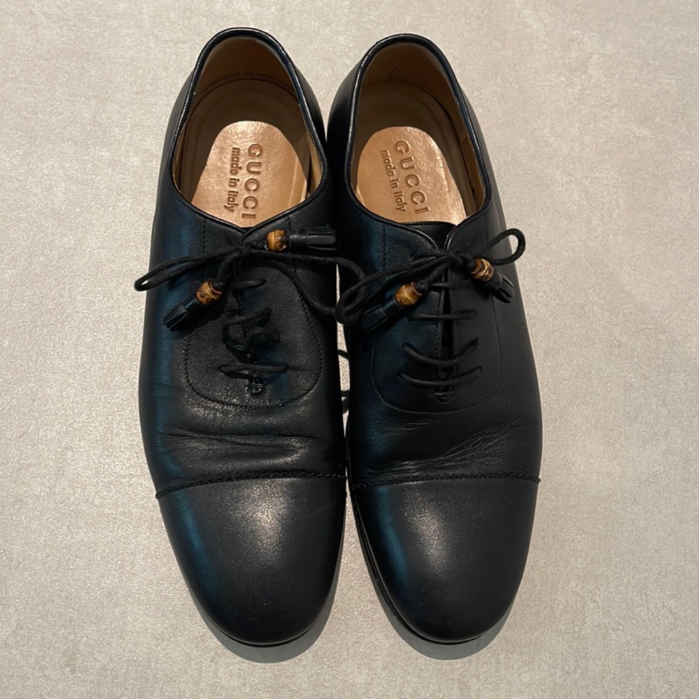 Gucci men size 7.5 used black dress shoes with straps with bead and tassel ends